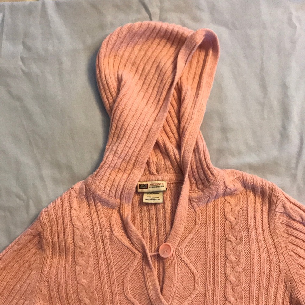 Hooded pink sweater.